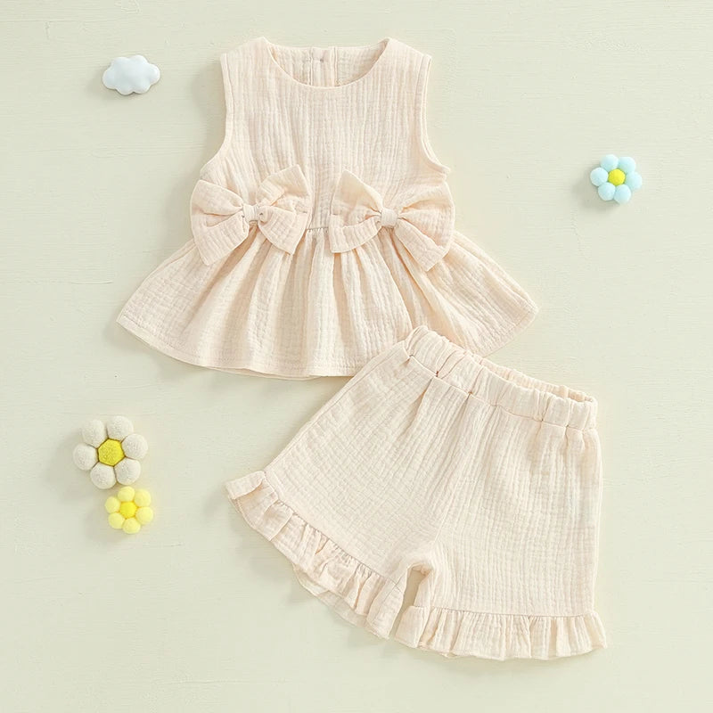 2024-12-24 Lioraitiin Toddler Baby Girl Summer Clothes Solid Color Bow Round Neck Tank Tops + Elastic Waist Ruffled Shorts Set