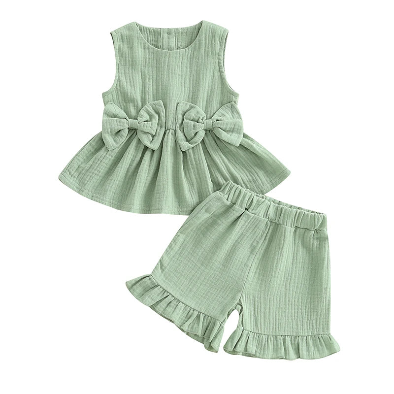 2024-12-24 Lioraitiin Toddler Baby Girl Summer Clothes Solid Color Bow Round Neck Tank Tops + Elastic Waist Ruffled Shorts Set