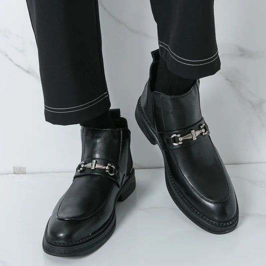In the autumn of 2025 the British business formal wear Chelsea boots features a man wearing high-top patent leather shoes