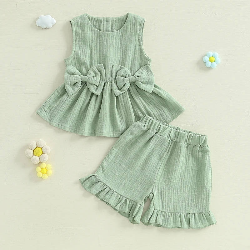 2024-12-24 Lioraitiin Toddler Baby Girl Summer Clothes Solid Color Bow Round Neck Tank Tops + Elastic Waist Ruffled Shorts Set